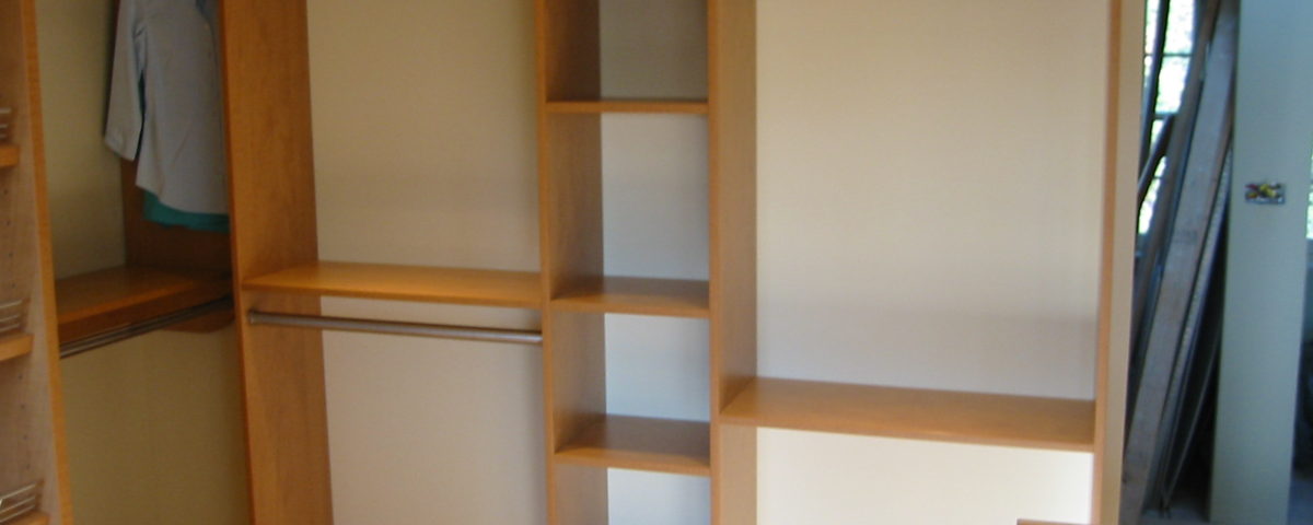 Built-in shelves in master bedroom closet