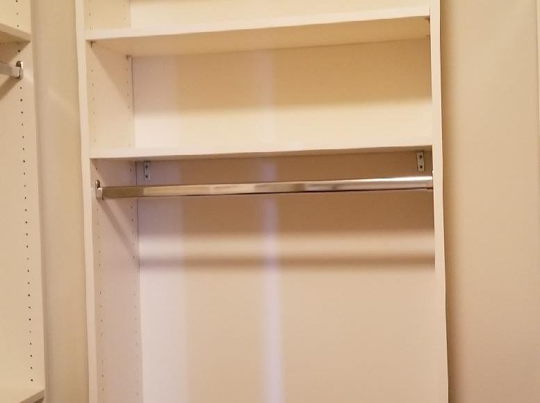 Lower rod with shelves above in closet system